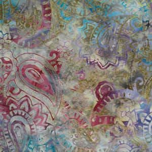 May include: A close-up of a fabric with a paisley pattern in shades of pink, purple, blue, and gold. The design features intricate floral and teardrop shapes, creating a textured and colorful textile.