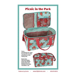 May include: A turquoise and red quilted tote bag with a zipped top and handles. The bag is open to reveal a mesh interior. The bag is labelled "Picnic in the Park".