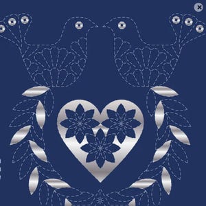 May include: A dark blue fabric featuring a silver metallic design of two birds facing each other above a central heart. The heart contains three floral shapes, and the entire composition is framed by two curved leafy branches in silver.