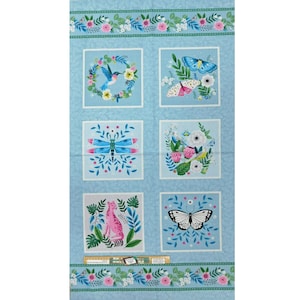 May include: A blue fabric with a repeating pattern of squares. Each square features a different floral design with butterflies, dragonflies, birds, and a leopard. The fabric has a green and white border.