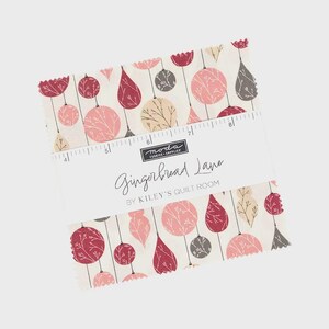 May include: Fabric squares featuring a repeating pattern of pink, red, and grey baubles on a cream background. The fabric is labelled "Gingerbread Lane" by Kiley's Quilt Room.