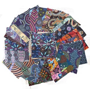 May include: A collection of 20 fabric squares featuring colourful Aboriginal art designs. The squares are made of cotton and are perfect for quilting, crafting, and other projects.