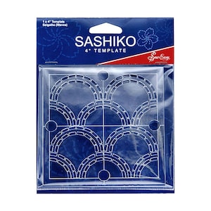 May include: A clear plastic template for sashiko stitching, featuring a 4-inch Seigaiha (Waves) design. The template is packaged in a blue and red plastic sleeve with the text "SASHIKO 4" TEMPLATE" and "Sew Easy".