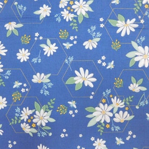 May include: A blue fabric with a white daisy pattern. The daisies are arranged in a honeycomb pattern with gold outlines.
