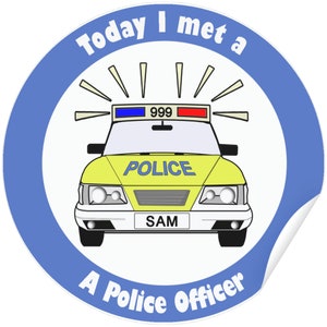 May include: A round sticker featuring a cartoon police car with the word "POLICE" on the front. The sticker has the text "Today I met a A Police Officer" around the edge. The license plate reads "SAM".