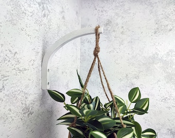 Wall mounted wooden hook for hanging plants white color.