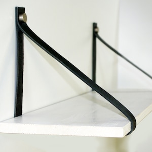 Wall shelf strap in black leather. Leather shelf holders. Wall Leather Shelf Straps Hanging Leather Shelf Brackets.