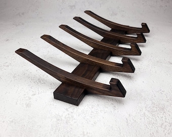 Coat rack in walnut color .  Wooden hooks for clothes.