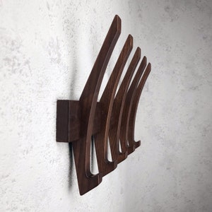 Modern coat rack in walnut color . Wall rack. Hat rack . Wooden hooks for clothes.