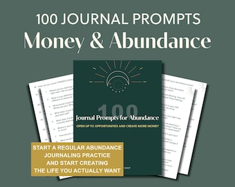 May include: A dark teal journal with the text "100 Journal Prompts for Abundance" and a gold sun and moon design. The journal is accompanied by loose-leaf pages with prompts. The image also includes text that reads "Money & Abundance."