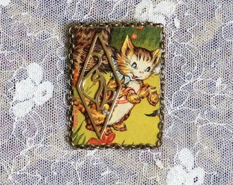 Kitty Jewelry, cat pin made from a vintage book cover accented with a piece of vintage jewelry