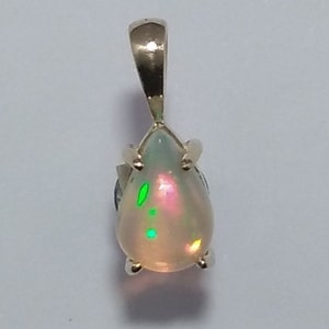 Beautiful Natural Ethiopian Opal Teardrop Cabochon set in a 14k Solid Yellow Gold Pendant