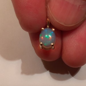 Natural Ethiopian Opal Pendant in a 14 Karat Solid Yellow Gold Pendant  see appraisal 435.00