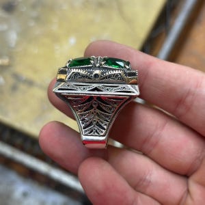 STG SILVER AND green stone ring