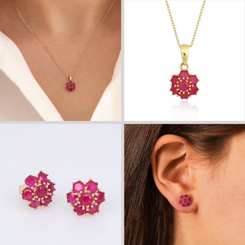 May include: A set of gold jewelry featuring a flower pendant necklace and matching earrings. The flower is made of small red gemstones.