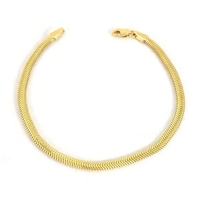 May include: A gold snake chain bracelet with a clasp closure.