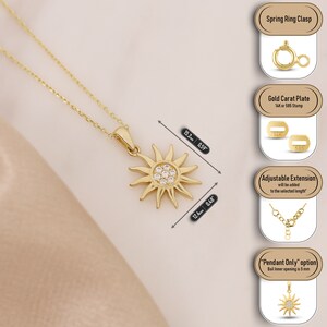 May include: A gold necklace with a sun pendant featuring clear cubic zirconia stones. The pendant measures 15mm in diameter and 12mm in height. The necklace is 38.6cm long and has a spring ring clasp. The necklace is available in 14K or 585 gold.