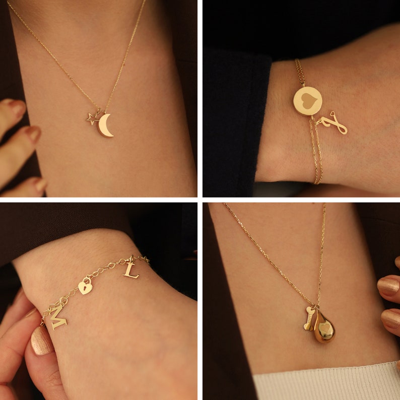 May include: Four gold necklaces and bracelets with different charms, including a crescent moon, a star, a heart, a padlock, a letter L, a letter M, a bone, and a teardrop.