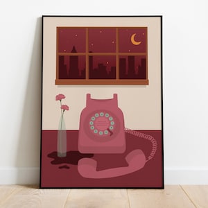 May include: A pink rotary phone with a black dial and a white cord sits on a table with a vase of pink flowers. The phone is in front of a window with a view of a city skyline at night. The window has a brown frame and the wall is a light beige color.