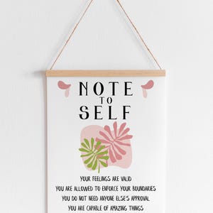 May include: A white printable poster with the text "NOTE TO SELF" in black bold letters. The poster features a pink and green abstract leaf design and includes the text "Your feelings are valid. You are allowed to enforce your boundaries. You do not need anyone else's approval. You are capable of amazing things. You are enough."