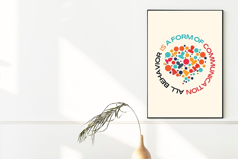 May include: A beige poster with a black frame features a colorful graphic of a speech bubble with the text "All behavior is a form of communication".