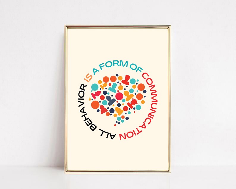 May include: A framed print with a colorful speech bubble design and the text "All behavior is a form of communication".