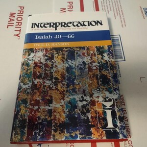 May include: A book titled "Interpretation: A Bible Commentary for Teaching and Preaching" with a colorful abstract design on the cover. The book is about Isaiah 40-66 and is by Paul D. Hanson.