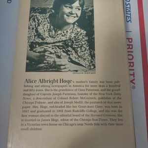 May include: A black and white photo of a woman with red hair. The photo is from a book about Alice Albright Hoge, a woman who has been involved in publishing and editing newspapers for over 100 years. The text on the page describes her family history and career.
