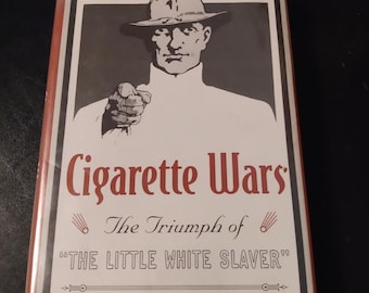 1st Edition - Cigarette Wars: The Triumph of "The Little White Slaver"  by Cassandra Tate ISBN 9780195118513 Hardcover 1999