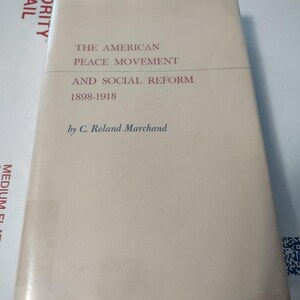 May include: The cover of a book titled "The American Peace Movement and Social Reform 1898-1918" by C. Roland Marchand.