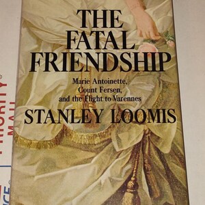 May include: A book titled "The Fatal Friendship: Marie Antoinette, Count Fersen, and the Flight to Varennes" by Stanley Loomis. The cover features a painting of a woman in a white dress with a gold sash and a pink rose.