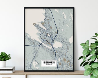 May include: A black framed print of a map of Bergen, Norway. The map is in shades of blue and green, with the city's streets and waterways highlighted. The text "Bergen, Norway" is printed in a white rectangle at the bottom of the map.