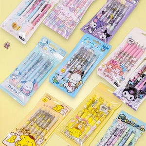 Juego de bolígrafos de gel de 0,5 mm: 6 bolígrafos recargables de clic, tinta negra, personajes adorables, escritura suave.