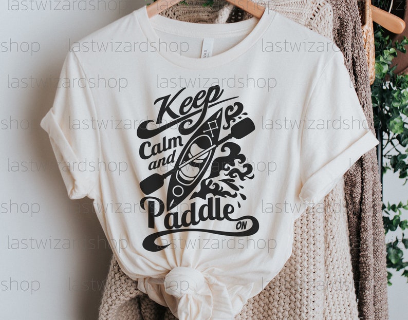 Digital download of a canoe and paddle design with quote for outdoor enthusiasts using Cricut or Silhouette machines.