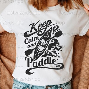 Rustic outdoor kayaking SVG featuring minimalist nature elements for adventure shirts, mugs, and lake house decor.