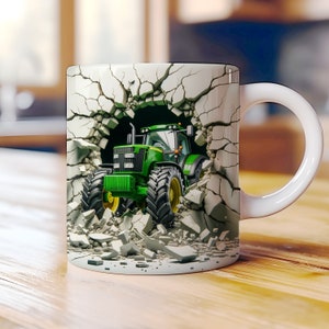 May include: A white ceramic mug with a green tractor breaking through a cracked concrete wall. The tractor is facing forward and has a black cab and black wheels.