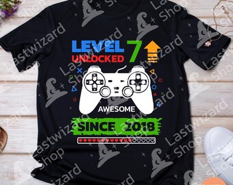 SVG de jugador de nivel 7 desbloqueado: Niño de 7.º cumpleaños con control de videojuego (descarga digital)