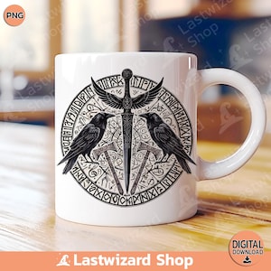 May include: White ceramic mug featuring a black and white design of two ravens, a sword, and axes encircled by runes. The design is centrally positioned on the mug.