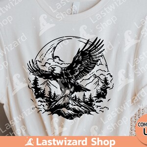 May include: Black and white silhouette of an eagle flying over a mountain range with clouds in the background. The eagle is in flight with its wings spread wide. The mountain range is in the distance and the clouds are in the foreground.