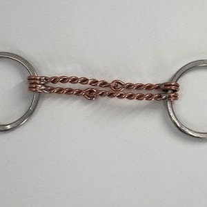 May include: A silver horse bit with a copper twisted wire mouthpiece.