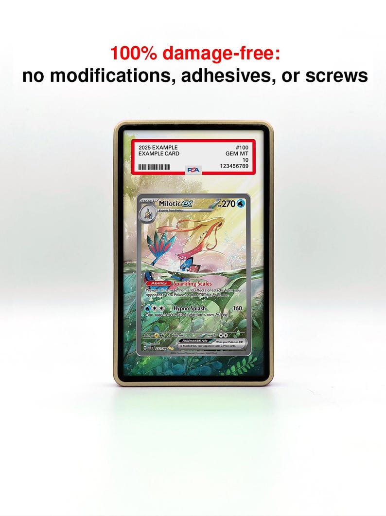 May include: A graded Pok&eacute;mon card in a protective case. The card features a Milotic character with a colorful aquatic background. The case has a gold-colored frame and the text "100% damage-free" is visible at the top.