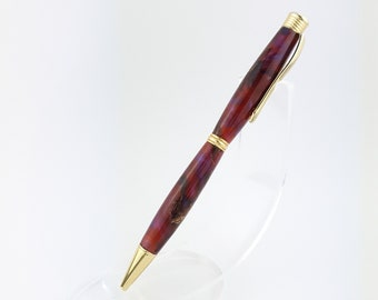 Ballpoint pen made of larch cones and resin, hand turned