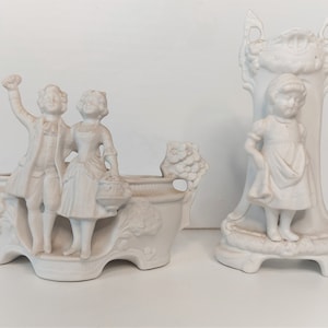 Two antique biscuit porcelain figurines / vases