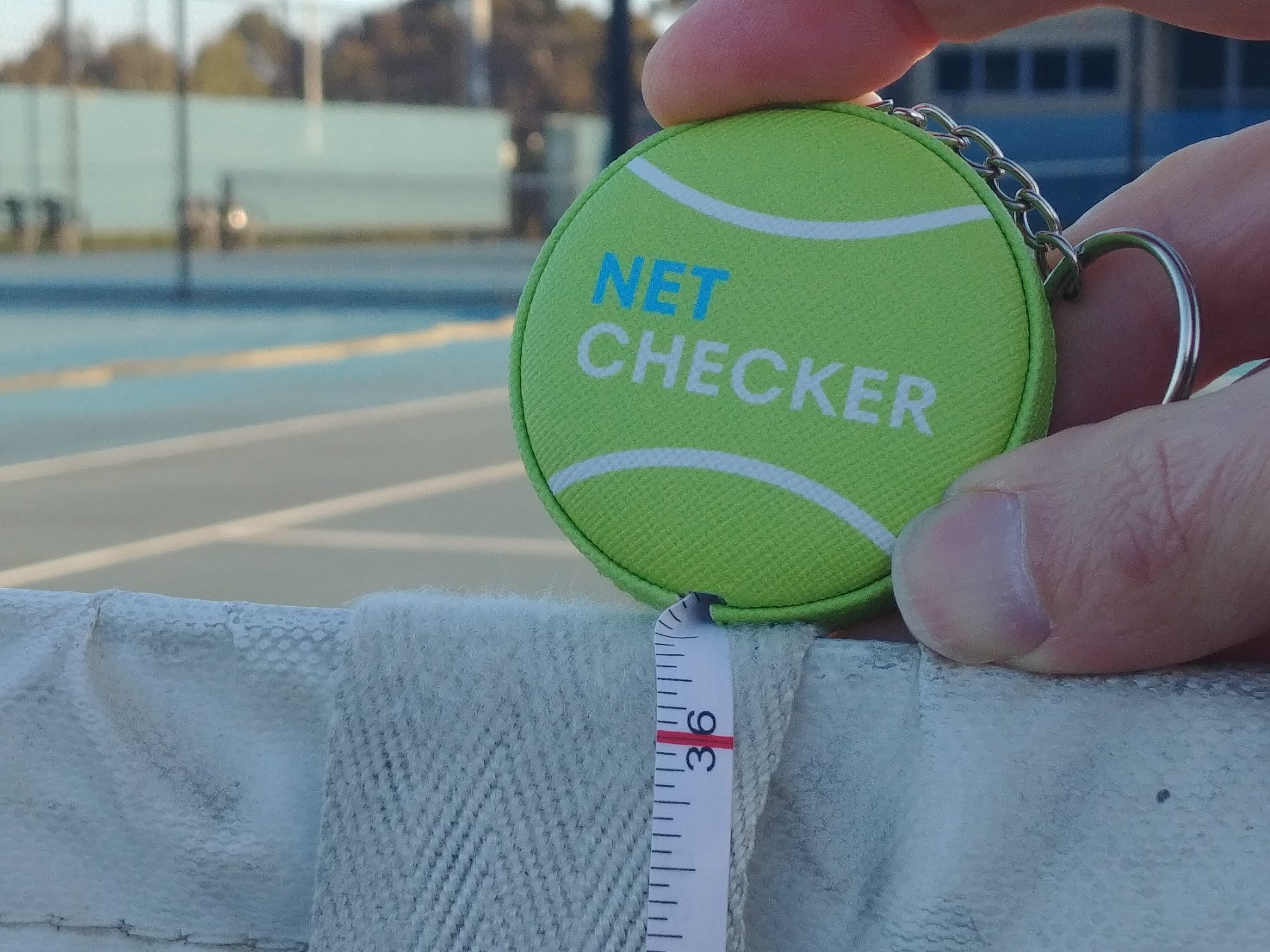 Tennis Net Height Measuring Device With a Tennis Ball Design