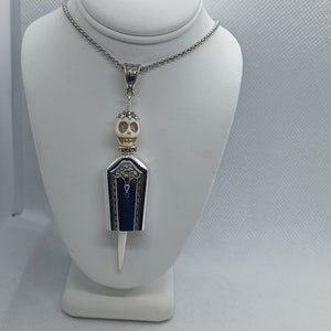 Skeleton bell pendant