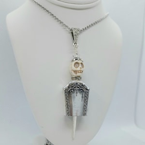 Skeleton bell pendant