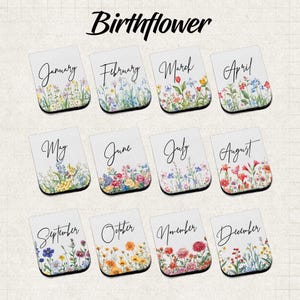 May include: Rectangular white magnets with floral designs representing each month of the year. Each magnet features a different arrangement of colorful flowers and the month's name in elegant script. The word "Birthflower" is written at the top.
