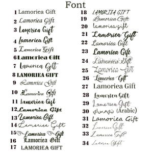 May include: A black and white image showcasing a variety of fonts, each displaying the text "Lamoriea Gift." The fonts range from elegant scripts to bold, block letters, with the word "Font" at the top.