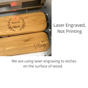 May include: Two wooden rectangular plaques with laser engraved text. The top plaque reads "Special Uncle" with a laurel wreath around the text. The bottom plaque reads "D'Boss" with an arrow pointing to the right. The text "Laser Engraved, Not Printing" is visible on the right side of the image. The text "We are using laser engraving to etches on the surface of wood." is visible below the image.