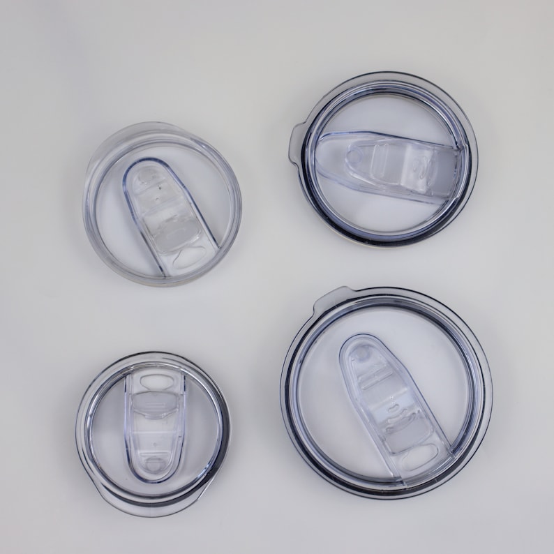 May include: Four clear plastic lids with a silicone seal and a push-on lid. The lids are different sizes.